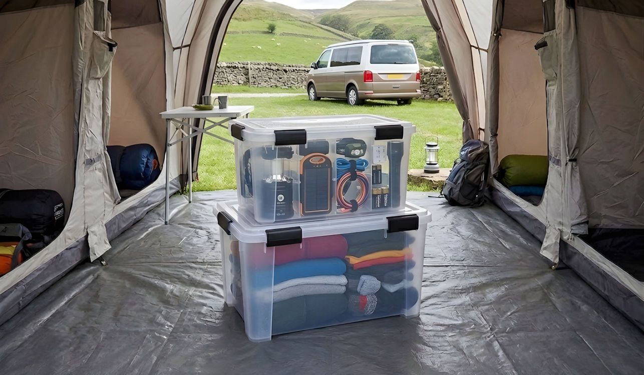 plastic storage boxes in a tent