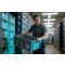 Man holding plastic container in warehouse