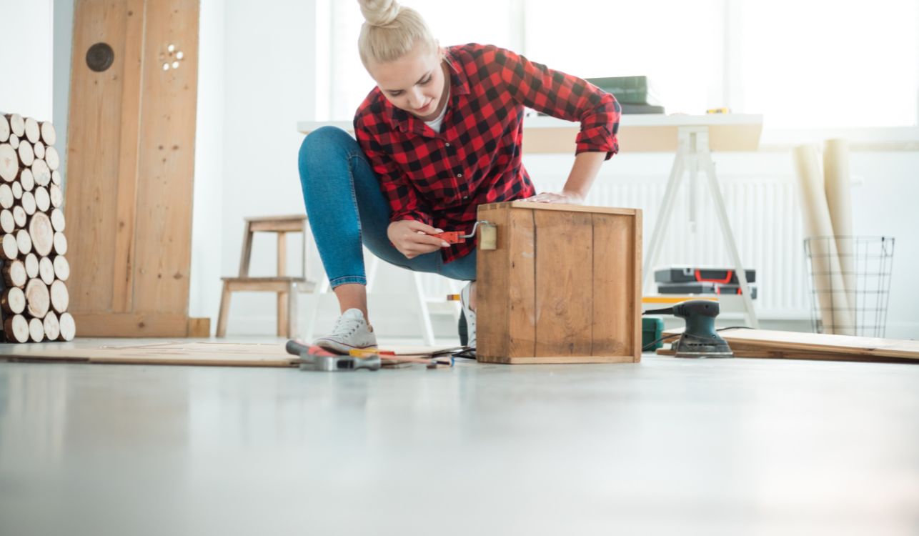 Woman creating a wooden box.