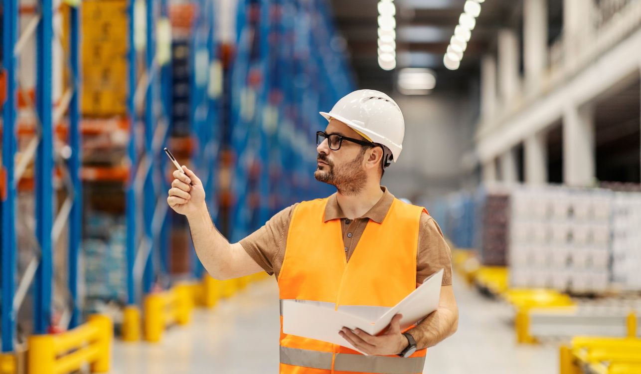 Manufacturing worker checking warehouse.